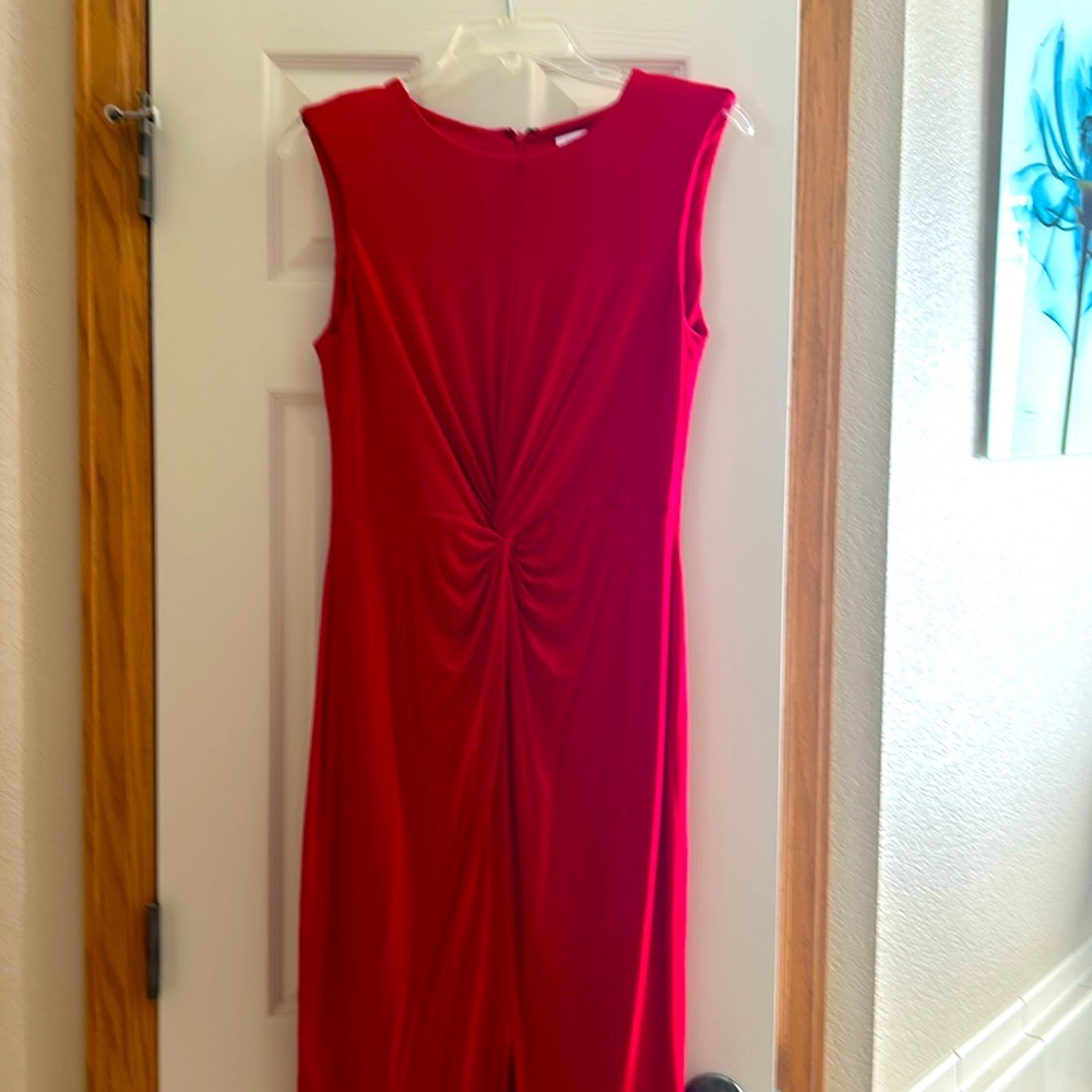 Brand new. Never worn. Removed tags and shoulder pads. Small slit in front.